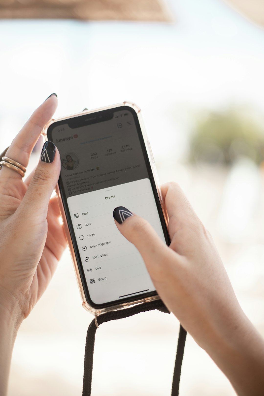 a person holding a cell phone in their hand a person holding a cell phone in their hand